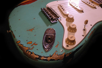 close up detail of electric guitar Body heavy Relic with selective focus.