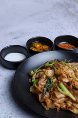 Thai food - Stir fried rice noodle with soy sauce. It’s called “Pad See Ew” in Thai language.