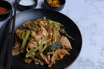 Thai food - Stir fried rice noodle with soy sauce. It’s called “Pad See Ew” in Thai language.