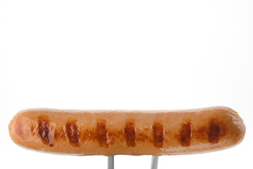 grill sausage on fork, white background