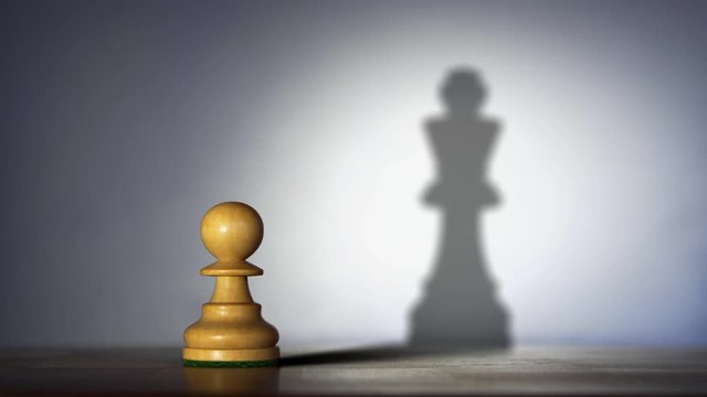 Megalomania. The pawn feels like a king. Chess concept.