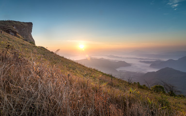 The scenery of Phu Chi Fah with sea of fog at sunrise time in Chiang Rai, Thailand.