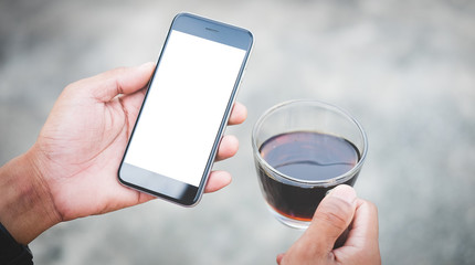 Cropped shot view of man hands holding smart phone with blank copy space screen for your text message or information content, female reading text message on cell telephone during in urban setting. 