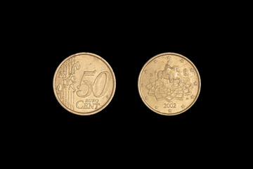 50 euro cent coin 2002 on a black background. Close-up on two sides.