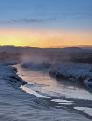 beutiful winter sunset over river in Iceland