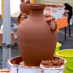 Ceramic vase made of clay in a pottery workshop.