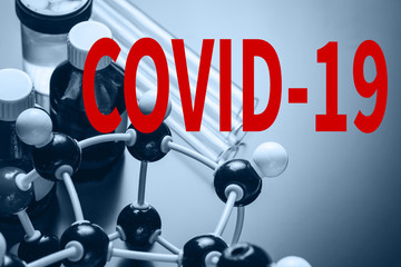 molecular formula and laboratory equipment on a dark background with copy space. Science organic...