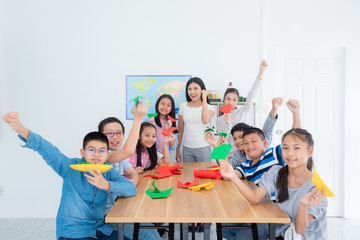 Teacher and student in origami ,paper folding class.