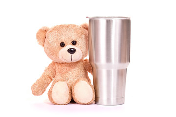 Teddy bear with Yeti glass on white background.