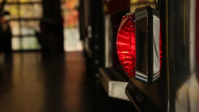 Emergency Lights On Side Of Firetruck Parked In Station