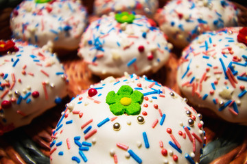 Easter cakes in a wicker basket. Homemade easter baking. Closeup, selective focus