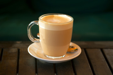 cup of coffee on wooden table