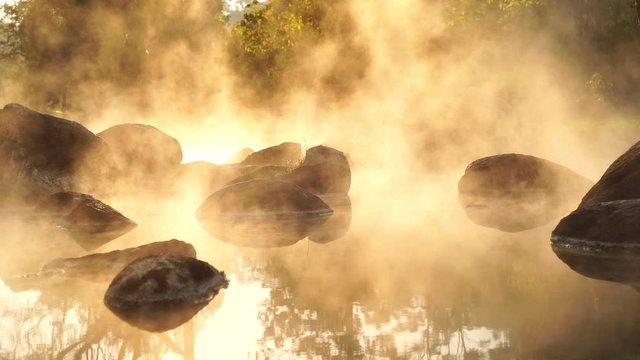 Hot Springs Onsen Natural Bath at National Park Chae Son, Lampang Thailand.In the morning sunrise.Natural hot spring bath surrounded by mountains in northern Thailand.