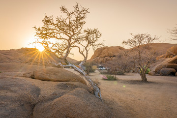 Camping life at sunrise in the Spitzkoppe National Park in Namibia in Africa.
