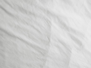 Soft white wrinkled fabric background