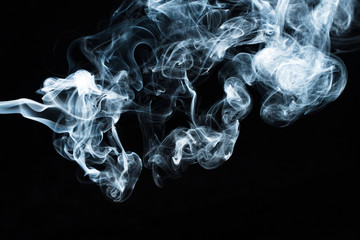 Photo of a wisp of smoke on a dark background