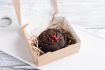 Chocolate cookies with raspberries in a gift box. Freeze-dried raspberries