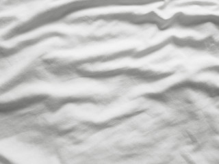 Soft white wrinkled fabric background