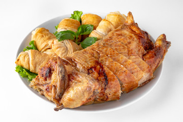 Baked stuffed duck in a cut with pancakes. Banquet festive dishes. Gourmet restaurant menu. White background.