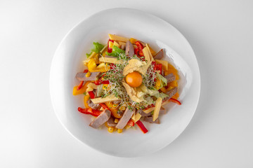 Salad of vegetables, meat and cheese with sauces. Banquet festive dishes. Gourmet restaurant menu. White background.