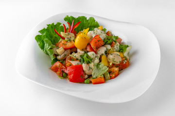 Salad of vegetables, meat and cheese with sauces. Banquet festive dishes. Gourmet restaurant menu. White background.