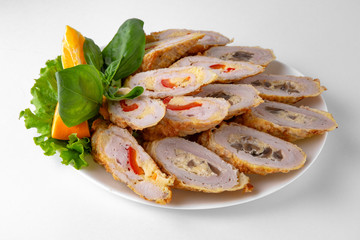 Sliced meatloaf with sauces. Banquet festive dishes. Gourmet restaurant menu. White background.
