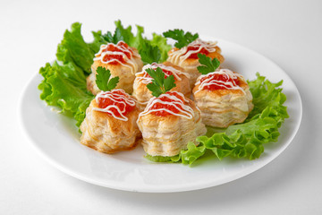 Crispy pastry tartlets with butter and red caviar. Banquet festive dishes. Gourmet restaurant menu. White background.