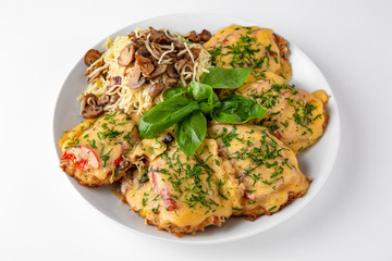 Meat chop with vegetables in egg batter with flour and noodles and mushrooms. Banquet festive...