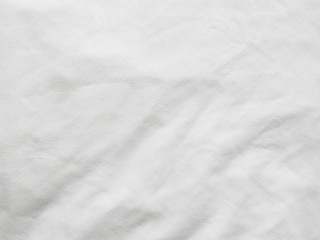 Soft white wrinkled fabric background