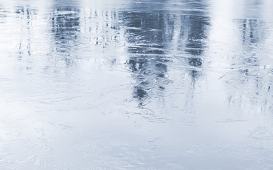 Fototapeta na wymiar Shiny blue wet ice surface background