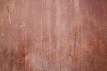 Red rusted metal sheet surface, background texture