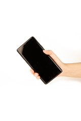 Mockup image of hand holding mobile phone on white background