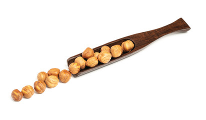 Peeled nuts isolated on white background in a wooden spoon