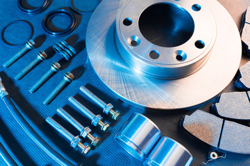 brake parts on dark background  brake pads, disc, brake hose, guides, cylinders - Image