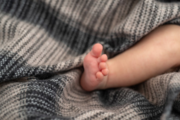Fototapeta na wymiar Close-up of a newborn baby's foot