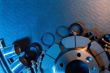 brake parts on dark background  brake pads, disc, brake hose, guides, cylinders - Image