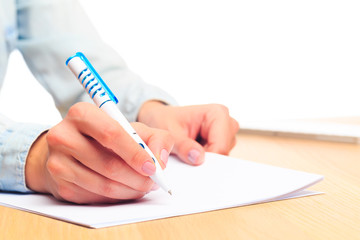 female hands write in a notebook . Office place  - Image