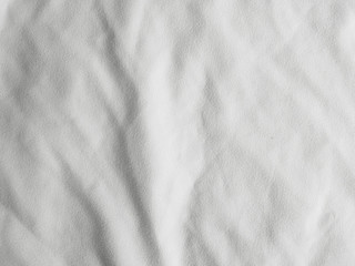 Fototapeta na wymiar Soft white wrinkled fabric background