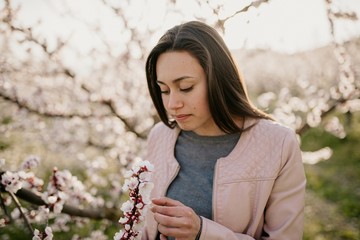 young woman with flowering tree