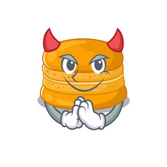 A picture of orange macaron in devil cartoon design