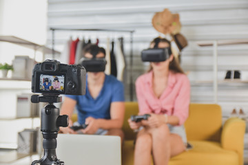Fototapeta premium Young happy friends sharing content on streaming platform blogger