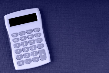 Modern calculator, business and Finance accounting concept on a black textural background, space...
