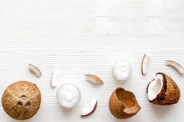 Homemade coconut cream on white wooden background top-down frame copy space