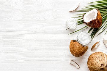 Homemade coconut cream on white wooden background top-down frame copy space