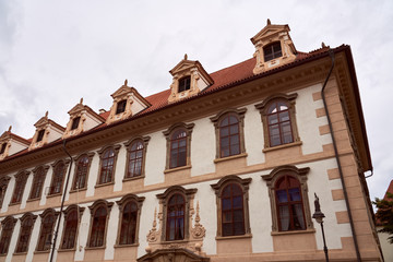 Obraz premium Prague cityscape with historic cityscape and the Prague castle. Horizontal photo of colorful European city of Prague in Czech Republic daytime, cloudy sky, month of may, travel in tourist place.