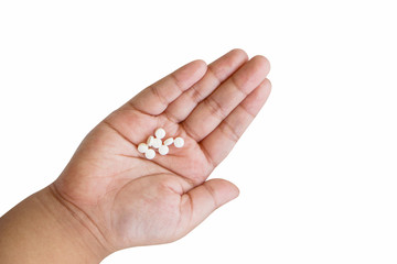 The medicine in the hands of a child on a isolated white background