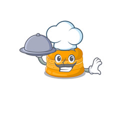 Orange macaron as a chef cartoon character with food on tray