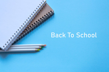 Set of stationery on blue background. Flat lay