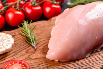 Fresh raw chicken fillet and vegetables prepared for cooking