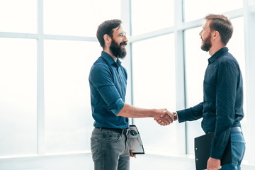 business people shaking hands before starting a business meeting